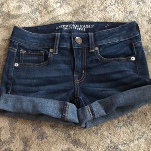 Low waist, dark washed jean shorts.